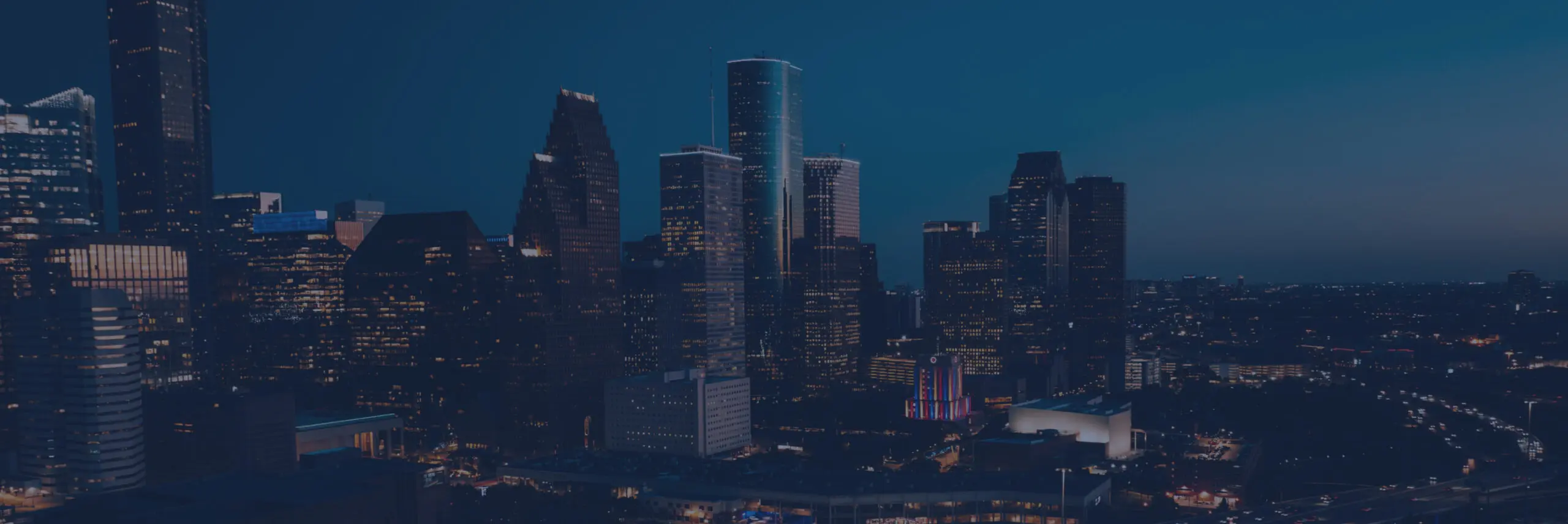 Houston Texas skyline at night representing Reality IMT nationwide 3D laser scanning, BIM, and building documentation services